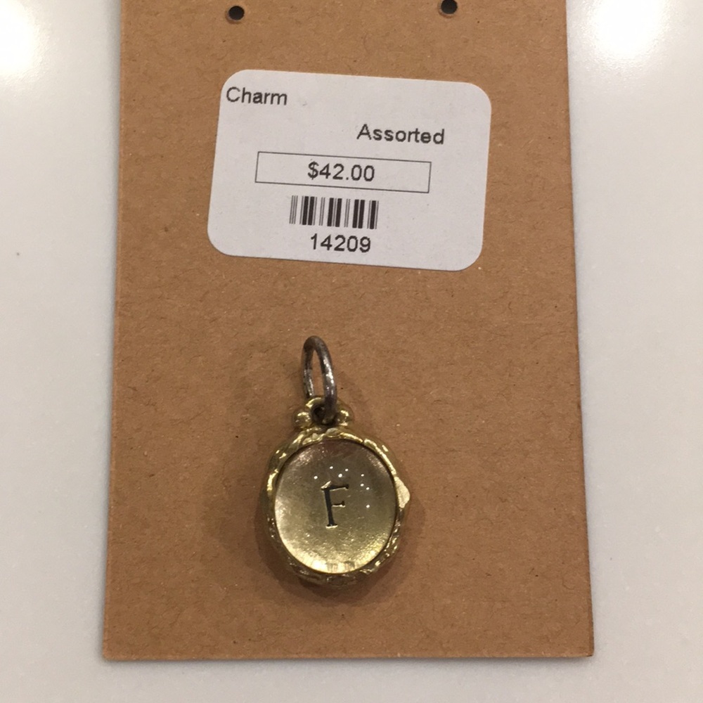 Intra insignia waxing poetic charm “F”